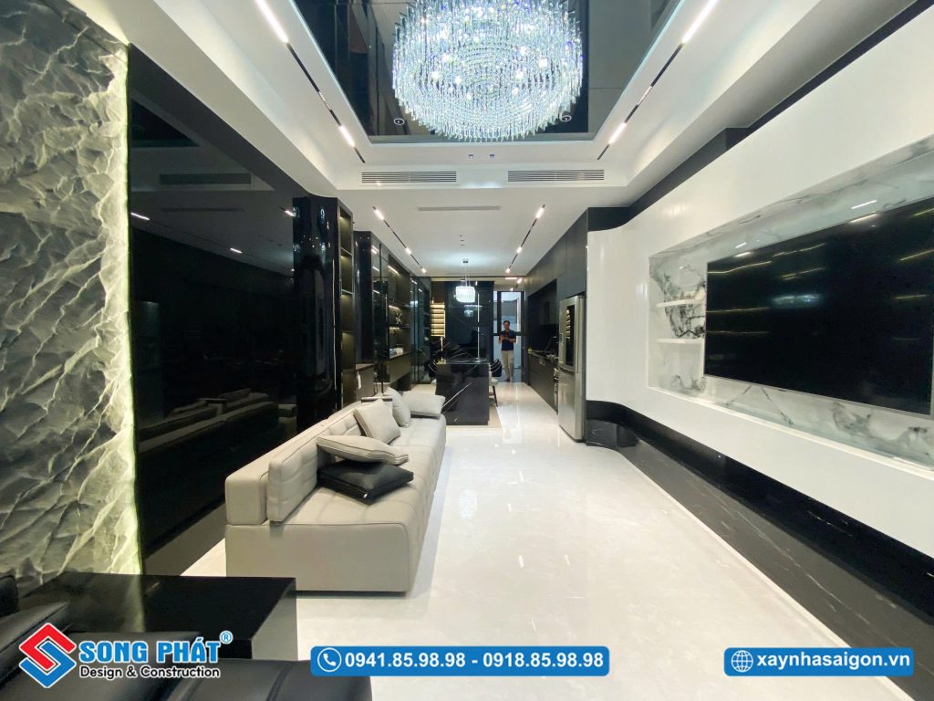 Điểm nhấn đèn chùm pha lê lộng lẫy, nâng tầm không gian phòng khách thêm sang trọng và đẳng cấp.