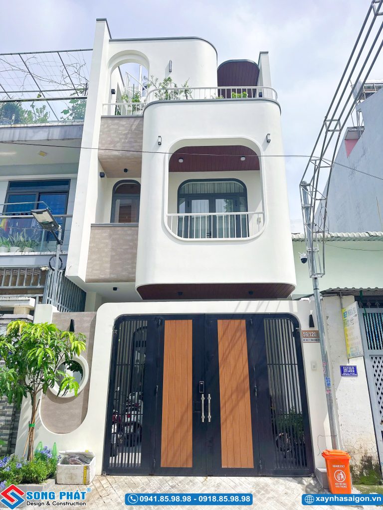 Mặt tiền nhà phố 3 tầng phong cách hiện đại bo tròn mềm mại.